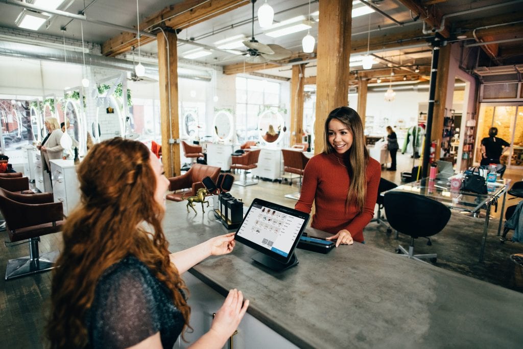 woman talking to a customer service worker