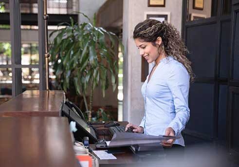 forbes-article-image-resized Receptionist working at the help desk
